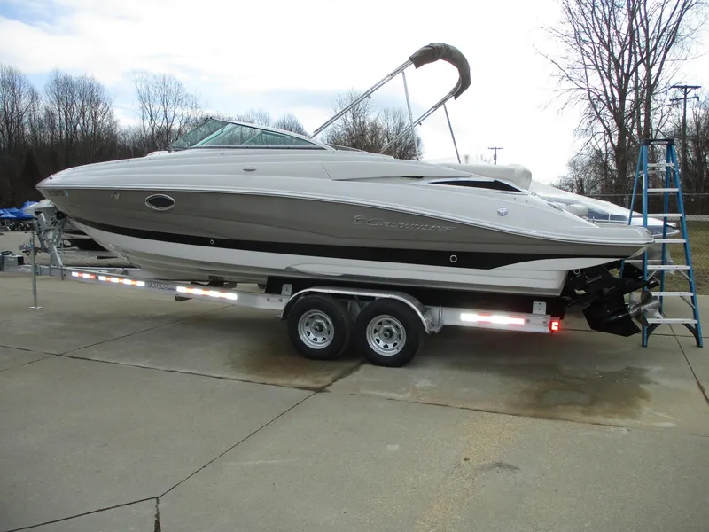 Slide: The Image of 2015 Crownline 285 SS boat on trailer, side view. - 3