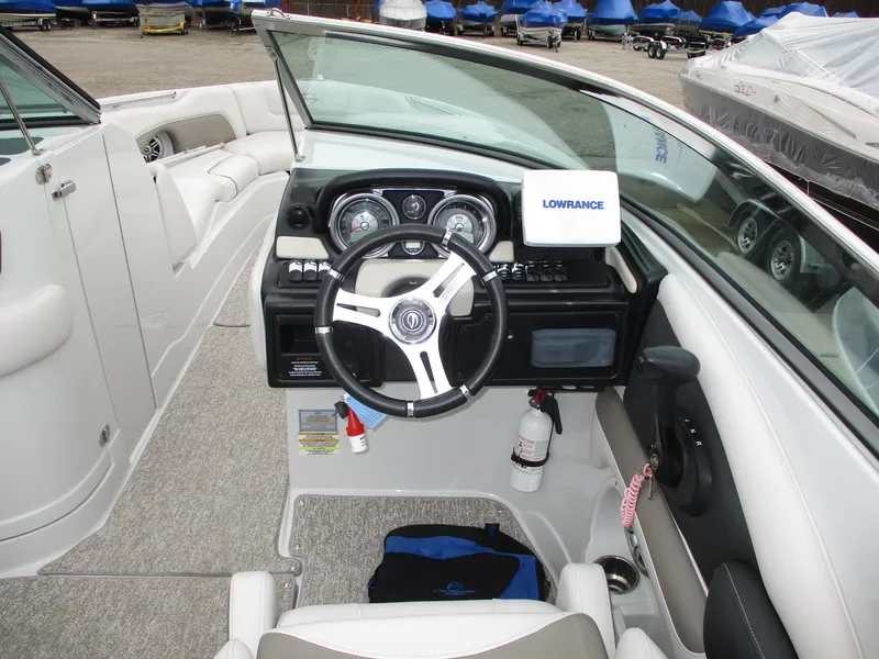 Slide: The Image of Interior view of a 2015 Crownline 285 SS boat with steering console. - 5
