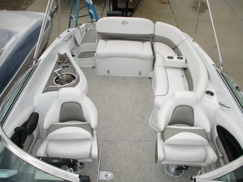 Slide: The Image of Interior of a 2015 Crownline 285 SS boat with white seating. - 8