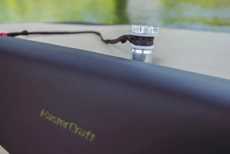 Slide: The Image of 2023 MasterCraft NXT24 boat detail with logo and cleat. - 14