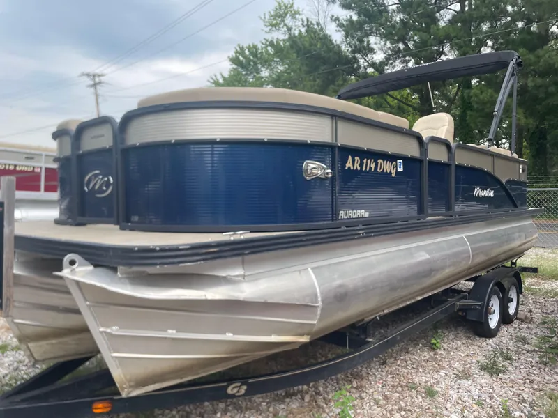Slide: The Image of 2021 Manitou 230 Aurora LE pontoon boat on a trailer. - 4