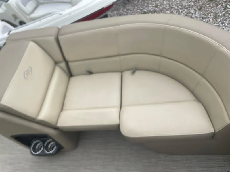 Slide: The Image of 2021 Manitou 230 Aurora LE boat with beige leather seating. - 7