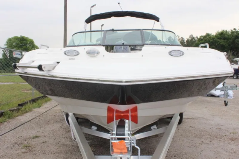 Slide: The Image of 2023 NauticStar 203 DC boat on a trailer, front view. - 10