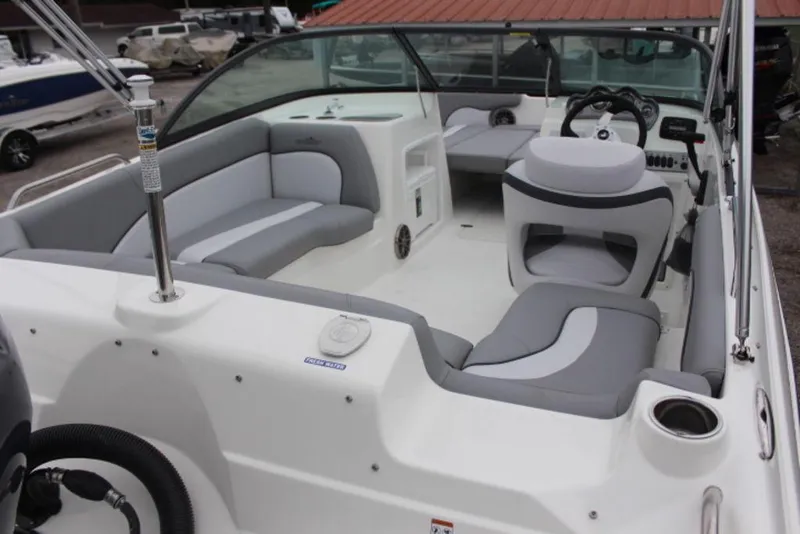 Slide: The Image of 2023 NauticStar 203 DC boat interior with gray and white seating. - 4