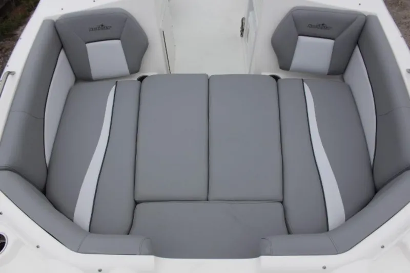 Slide: The Image of 2023 NauticStar 203 DC boat with gray and white cushioned seating. - 7