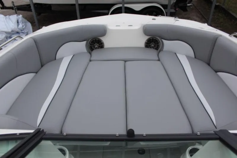 Slide: The Image of 2023 NauticStar 203 DC boat with spacious, cushioned seating area. - 8