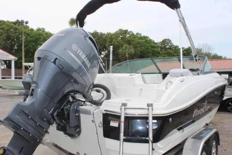 Slide: The Image of 2023 NauticStar 203 DC boat with Yamaha outboard motor, rear view. - 9