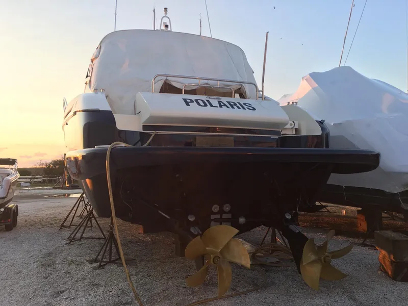Slide: The Image of 2004 Baia 54 yacht "Polaris" on dry dock at sunset. - 29