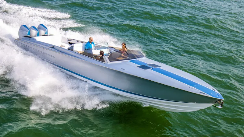Slide: The Image of 2026 Nor-Tech 420 Monte Carlo speedboat cruising on open water. - 11