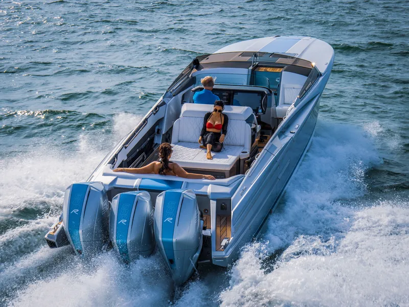 Slide: The Image of 2026 Nor-Tech 420 Monte Carlo cruising on open water with passengers enjoying the ride. - 2