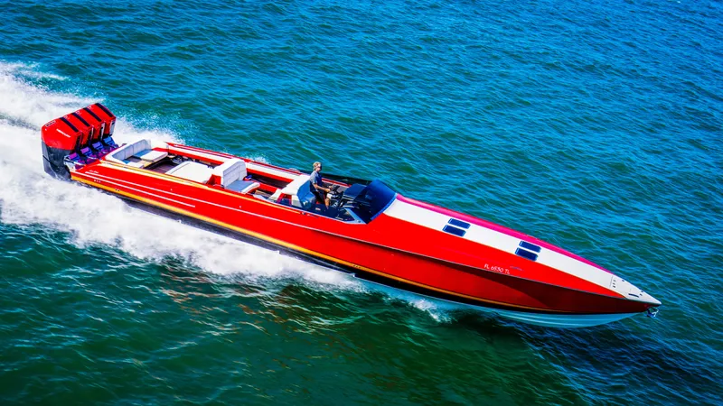 Slide: The Image of 2026 Nor-Tech 550 & 560 Sport Center Console speeding on open water. - 13