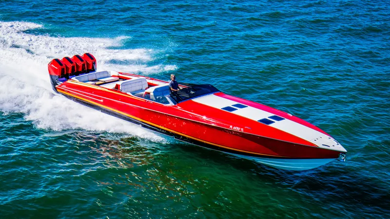 Slide: The Image of 2026 Nor-Tech 550 & 560 Sport Center Console speeding on open water. - 14