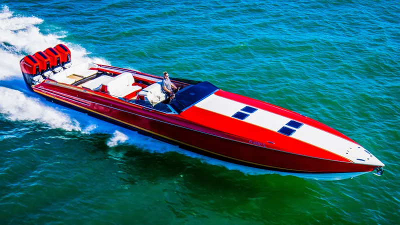 Slide: The Image of Red 2026 Nor-Tech 550 & 560 Sport Center Console boat cruising on open water. - 4