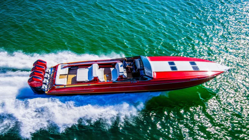 Slide: The Image of 2026 Nor-Tech 550 & 560 Sport Center Console speeding on vibrant blue water. - 8