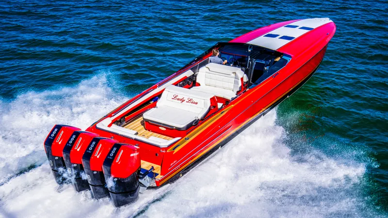 Slide: The Image of 2026 Nor-Tech 550 & 560 Sport Center Console, red, speeding on water with four engines. - 9