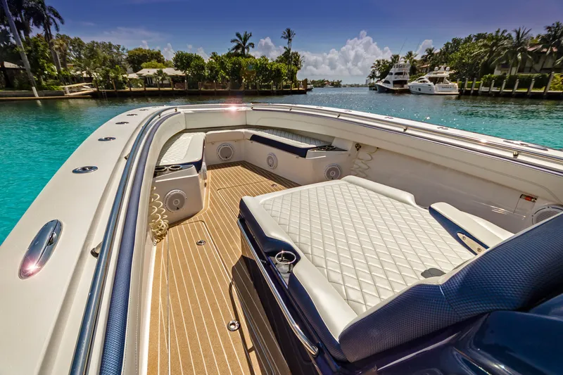 Slide: The Image of Luxurious 2026 Nor-Tech 392 Super Fish boat interior with plush seating and scenic waterfront view. - 10