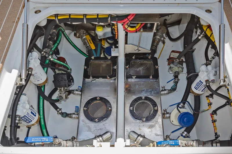Slide: The Image of Engine compartment of a 2026 Nor-Tech 392 Super Fish boat, showcasing complex wiring and components. - 13