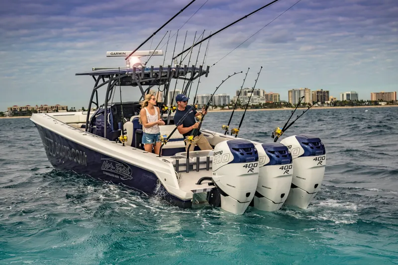 Slide: The Image of 2026 Nor-Tech 392 Super Fish boat with fishing rods and triple Mercury 400R engines. - 14