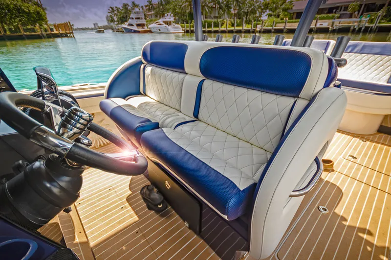 Slide: The Image of Luxurious seating on 2026 Nor-Tech 392 Super Fish boat with elegant blue and white upholstery. - 4