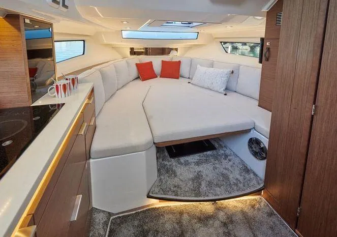 Slide: The Image of 2024 Jeanneau Leader 10.5 WA S2 interior cabin with modern amenities. - 13