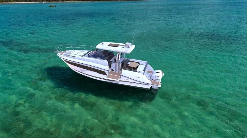 Slide: The Image of 2024 Jeanneau Leader 10.5 WA S2 boat on clear turquoise water. - 4