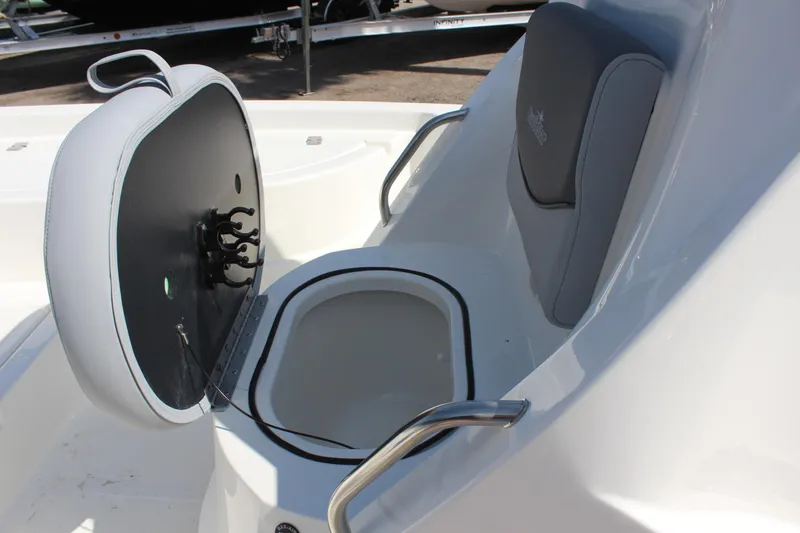 Slide: The Image of 2023 NauticStar 215 XTS boat seat with storage compartment open. - 13