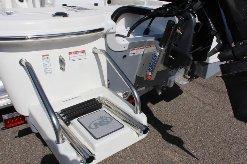 Slide: The Image of 2023 NauticStar 215 XTS boat with swim platform and motor detail. - 9