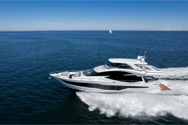 Slide: The Image of 2023 Galeon 800 Fly luxury yacht cruising on open water. - 0