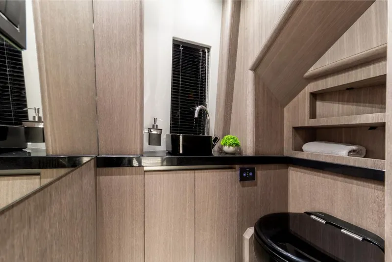 Slide: The Image of Modern bathroom in 2023 Galeon 800 Fly yacht with sleek wood finishes. - 14