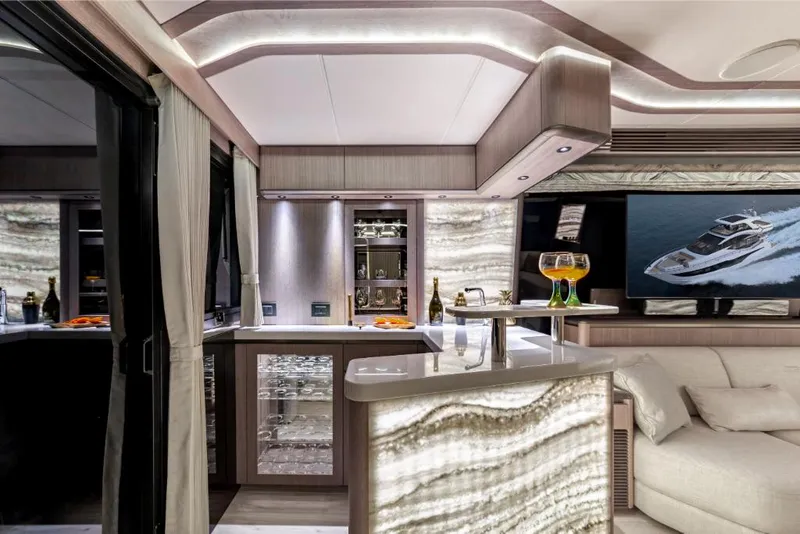 Slide: The Image of Luxurious interior of 2023 Galeon 800 Fly yacht with modern bar and seating area. - 15