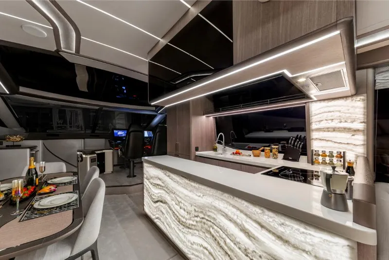 Slide: The Image of Luxurious interior of 2023 Galeon 800 Fly yacht with modern kitchen and dining area. - 21