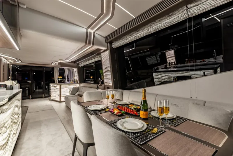 Slide: The Image of Luxurious dining area on the 2023 Galeon 800 Fly yacht with elegant table setting. - 22