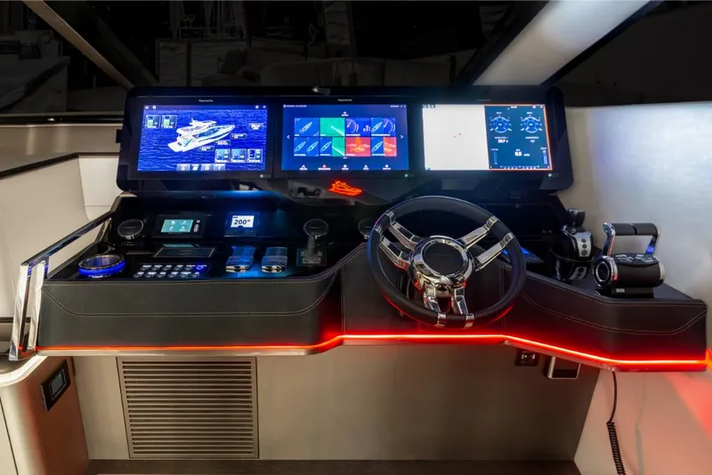 Slide: The Image of 2023 Galeon 800 Fly yacht helm with advanced navigation screens and controls. - 26