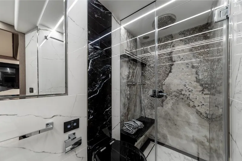 Slide: The Image of Luxurious bathroom in 2023 Galeon 800 Fly yacht with modern shower and marble finishes. - 31