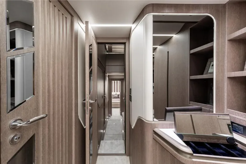 Slide: The Image of Interior hallway of 2023 Galeon 800 Fly yacht with modern wood finishes. - 34