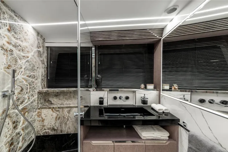 Slide: The Image of Luxurious bathroom in 2023 Galeon 800 Fly yacht with modern fixtures and marble accents. - 36