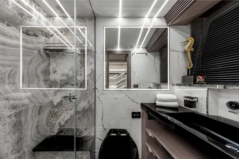 Slide: The Image of Luxurious bathroom in 2023 Galeon 800 Fly yacht with modern design and marble accents. - 38