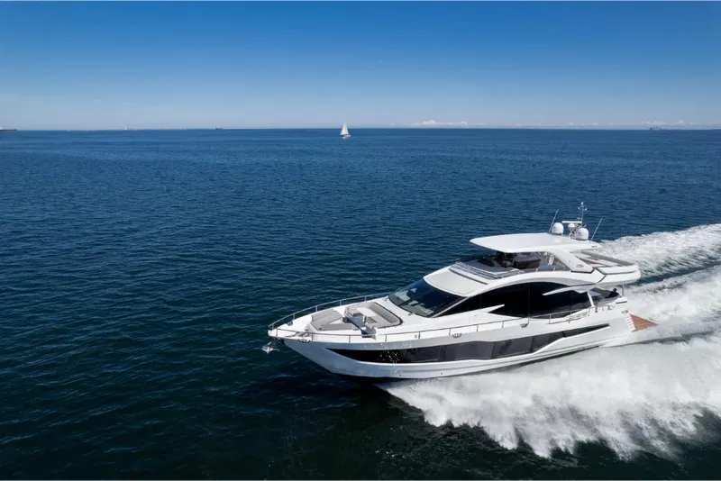 Slide: The Image of 2023 Galeon 800 Fly yacht cruising on open water. - 4