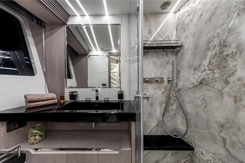 Slide: The Image of Luxurious bathroom in 2023 Galeon 800 Fly yacht with modern fixtures and marble shower. - 40