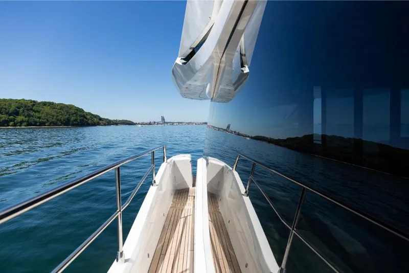 Slide: The Image of 2023 Galeon 800 Fly yacht cruising on a clear, sunny day. - 41