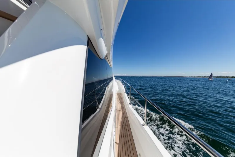 Slide: The Image of 2023 Galeon 800 Fly yacht cruising on open water. - 42