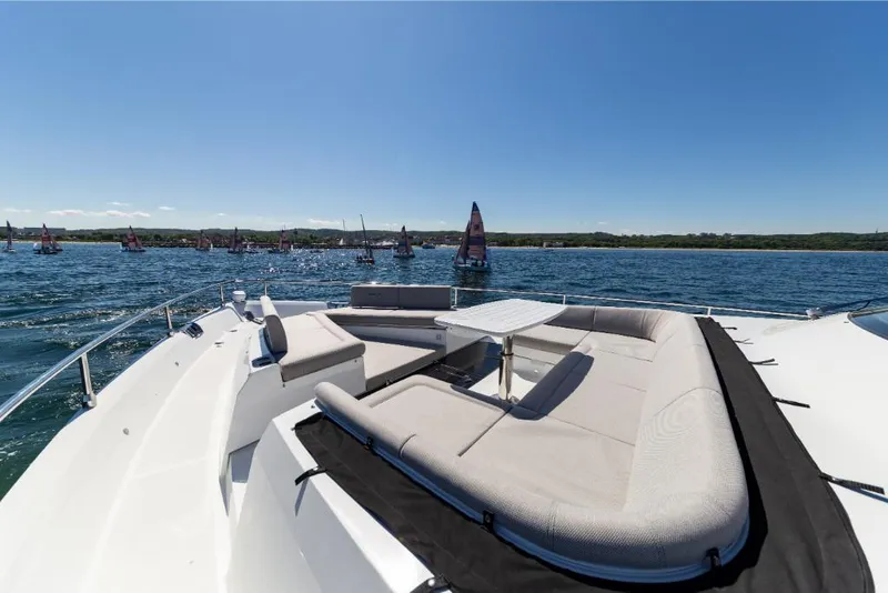 Slide: The Image of Luxury seating area on the 2023 Galeon 800 Fly yacht, with scenic ocean view. - 44