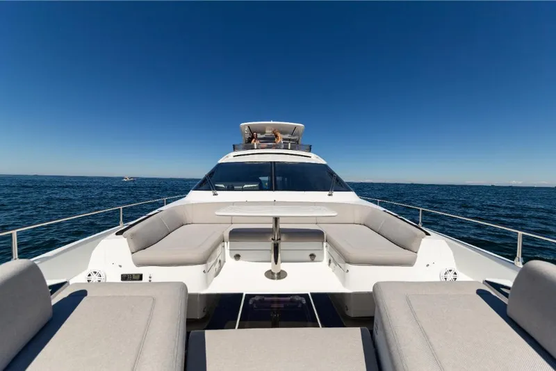 Slide: The Image of 2023 Galeon 800 Fly yacht on open water, front deck view. - 45
