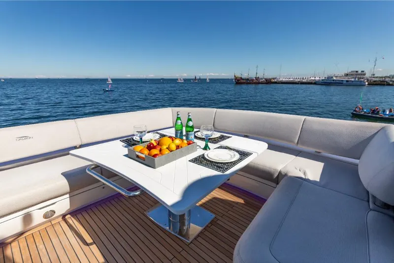 Slide: The Image of Luxury dining area on the 2023 Galeon 800 Fly yacht with ocean view. - 49