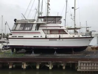 Slide: The Image of 1981 Gulfstar MY yacht docked at a marina. - 1