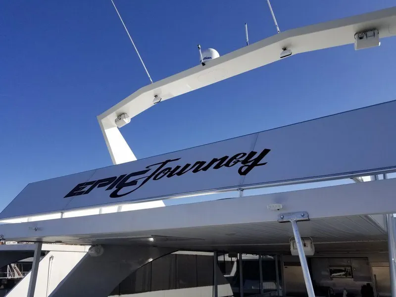 Slide: The Image of Luxury Bravada Epic Journey yacht, 2016 model, under clear blue sky. - 14