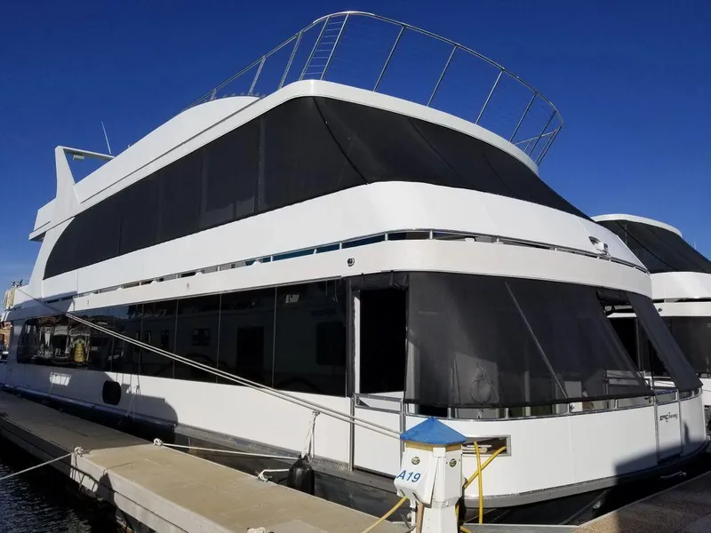 Slide: The Image of 2016 Bravada Epic Journey houseboat docked under clear blue sky. - 15
