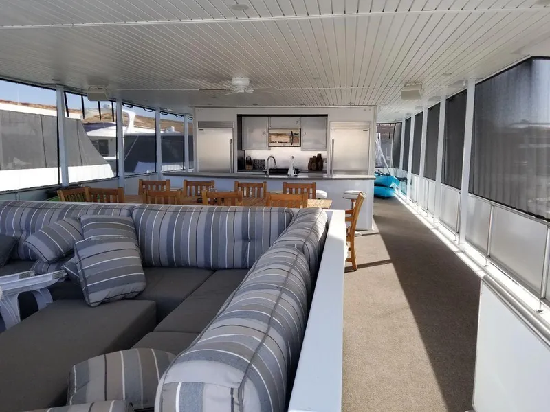 Slide: The Image of Luxurious interior of 2016 Bravada Epic Journey houseboat with spacious seating and dining area. - 4