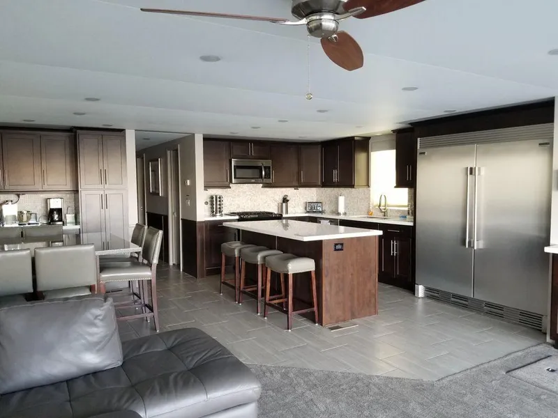 Slide: The Image of Luxurious kitchen interior in a 2016 Bravada Epic Journey, featuring modern appliances and sleek design. - 6