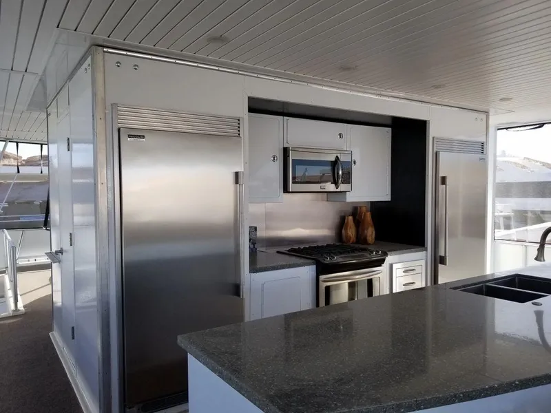 Slide: The Image of Luxurious kitchen on 2016 Bravada Epic Journey yacht, featuring modern appliances and sleek design. - 8